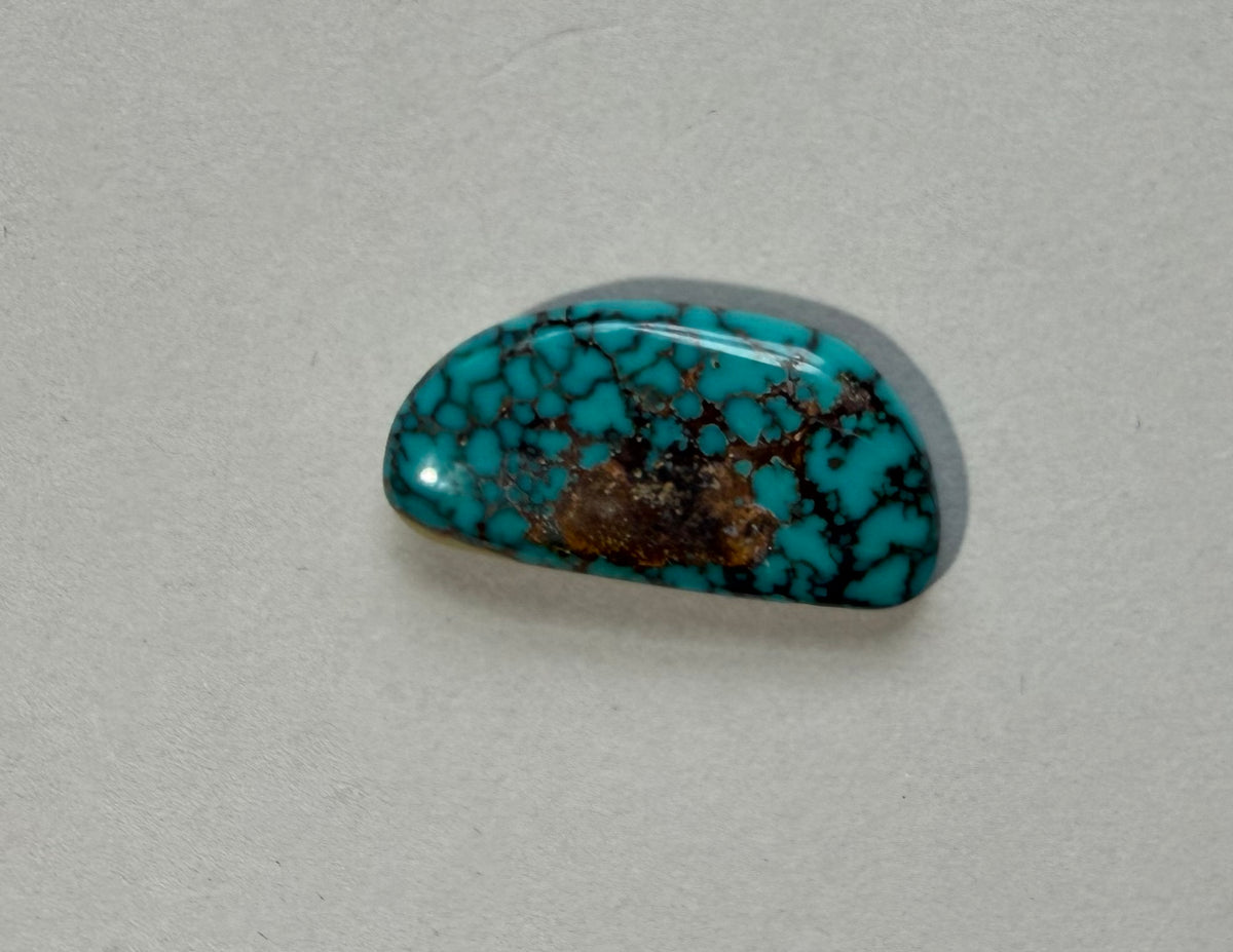 Stabilized Montezuma turquoise cabochon M-075 front view