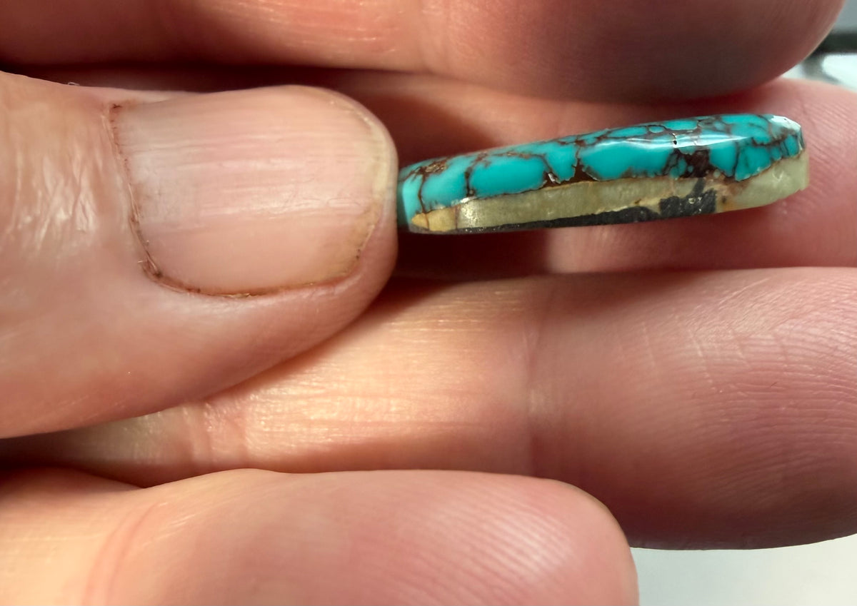 Stabilized Montezuma turquoise cabochon M-075 side profile showing backing