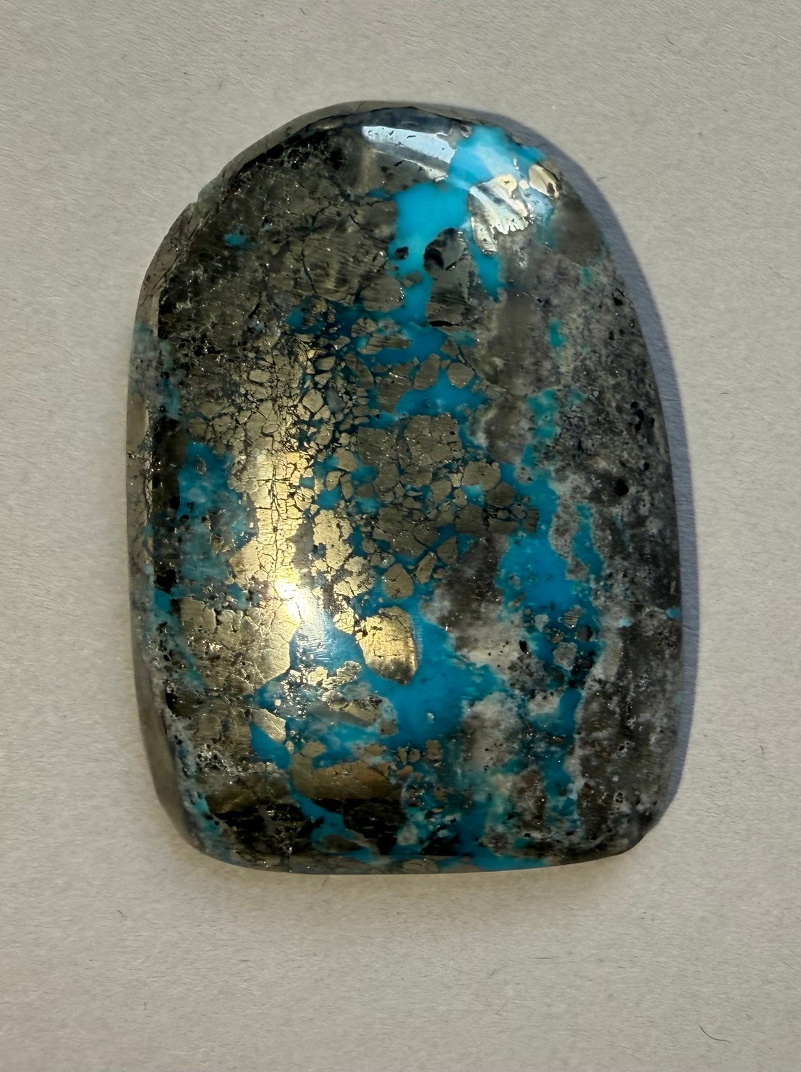 Persian turquoise cabochon PE-04 in hand