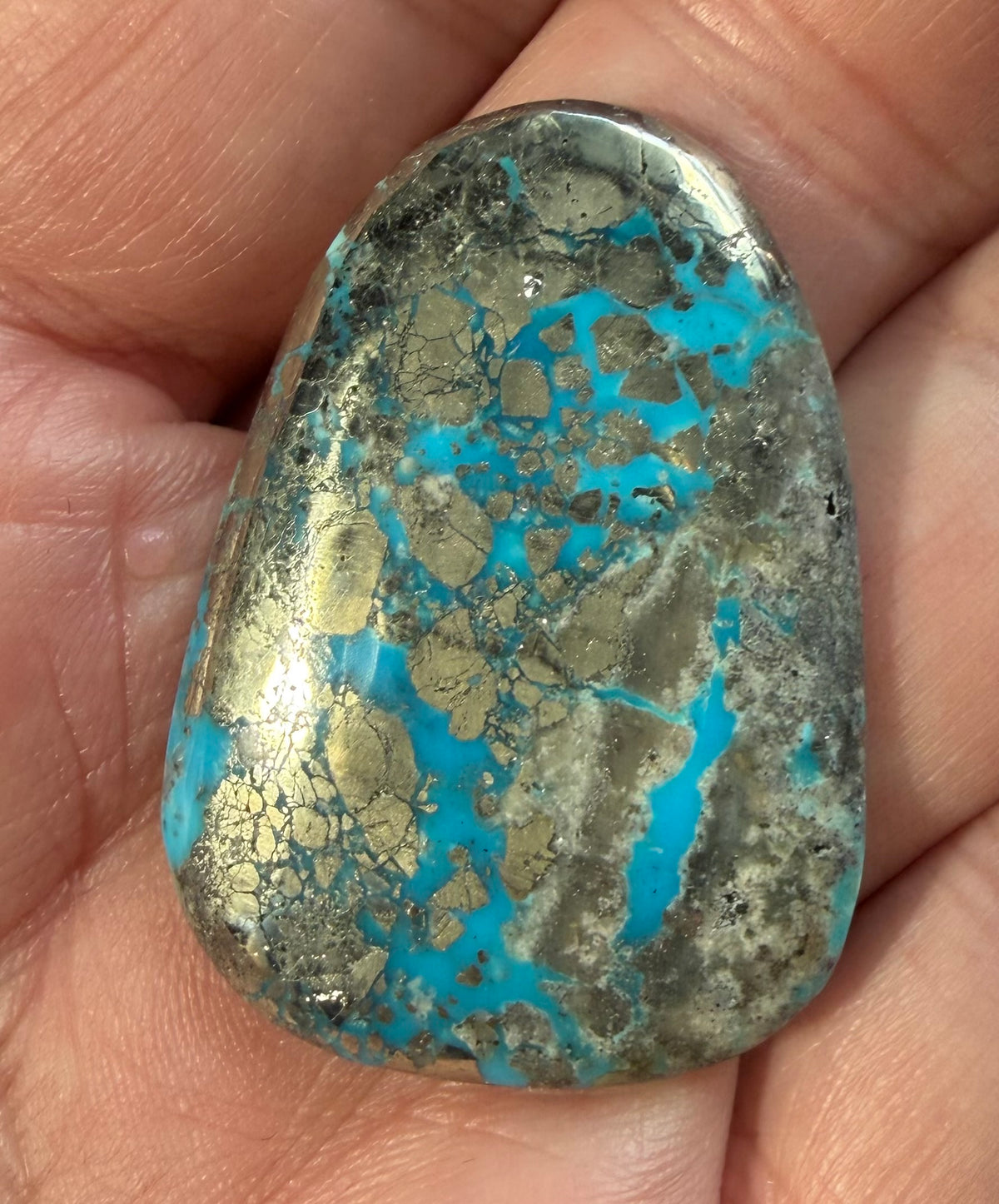 Persian turquoise cabochon PE-05 in hand