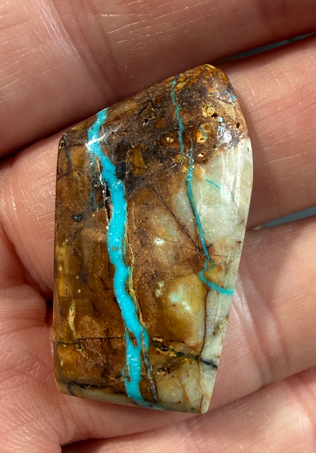 Royal Blue ribbon turquoise cabochon RB-006-N in hand