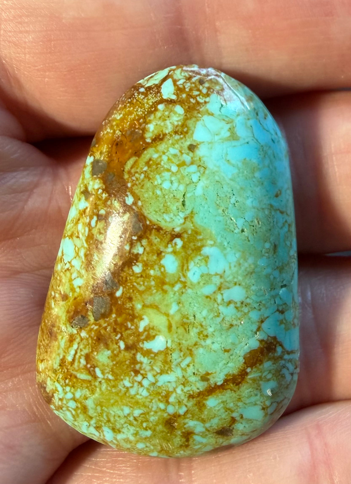 Stella Blue Arizona turquoise cabochon SB-032 in hand